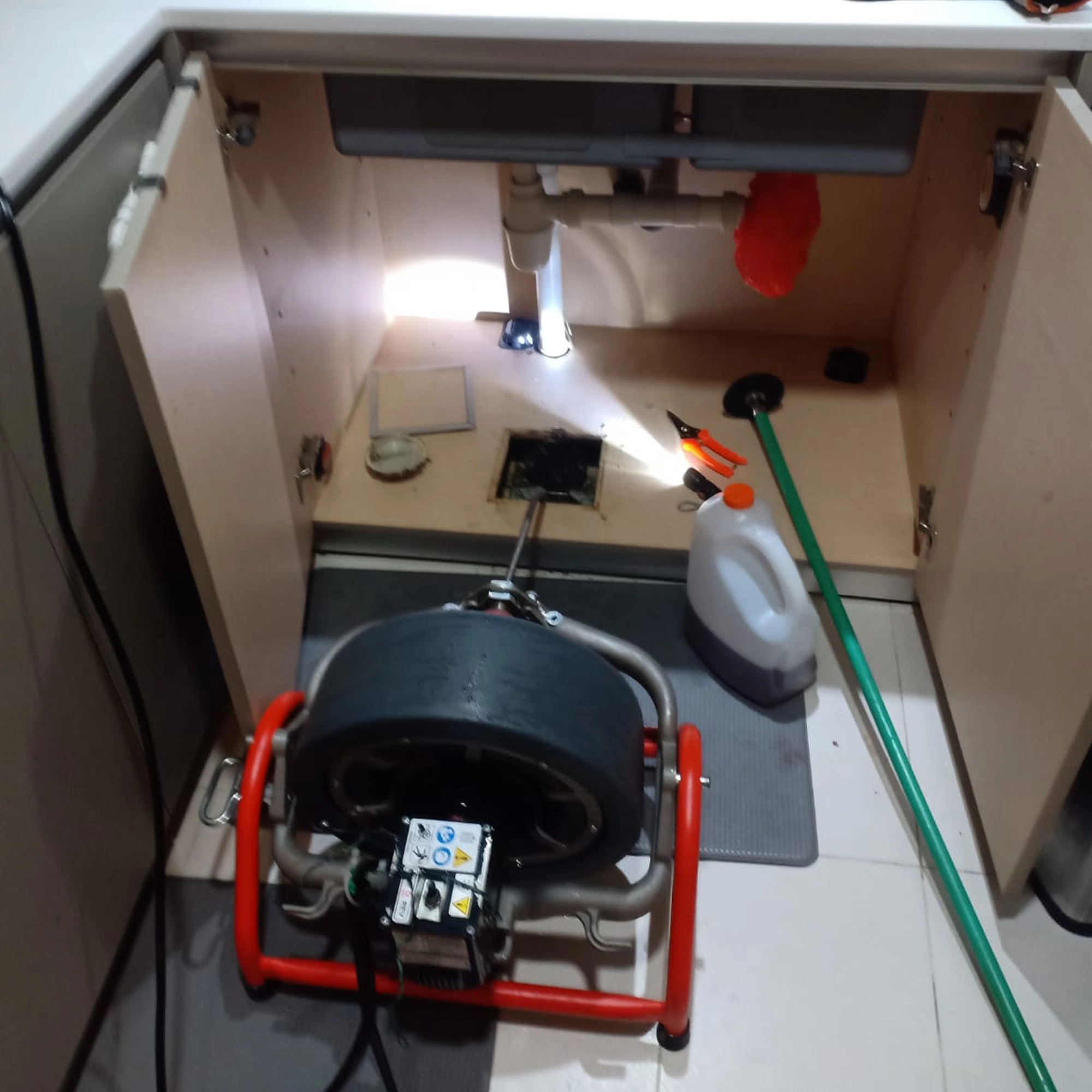 Deep unclogging of kitchen floor trap with specialist equipment